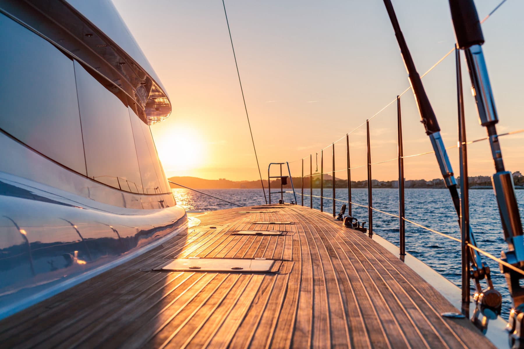 Luxury motor yacht on the water at golden sunset